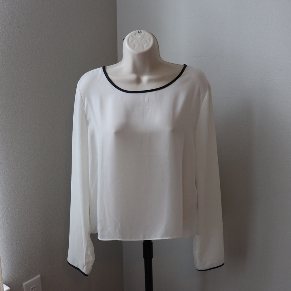 White long sleeved shirt with black outline
